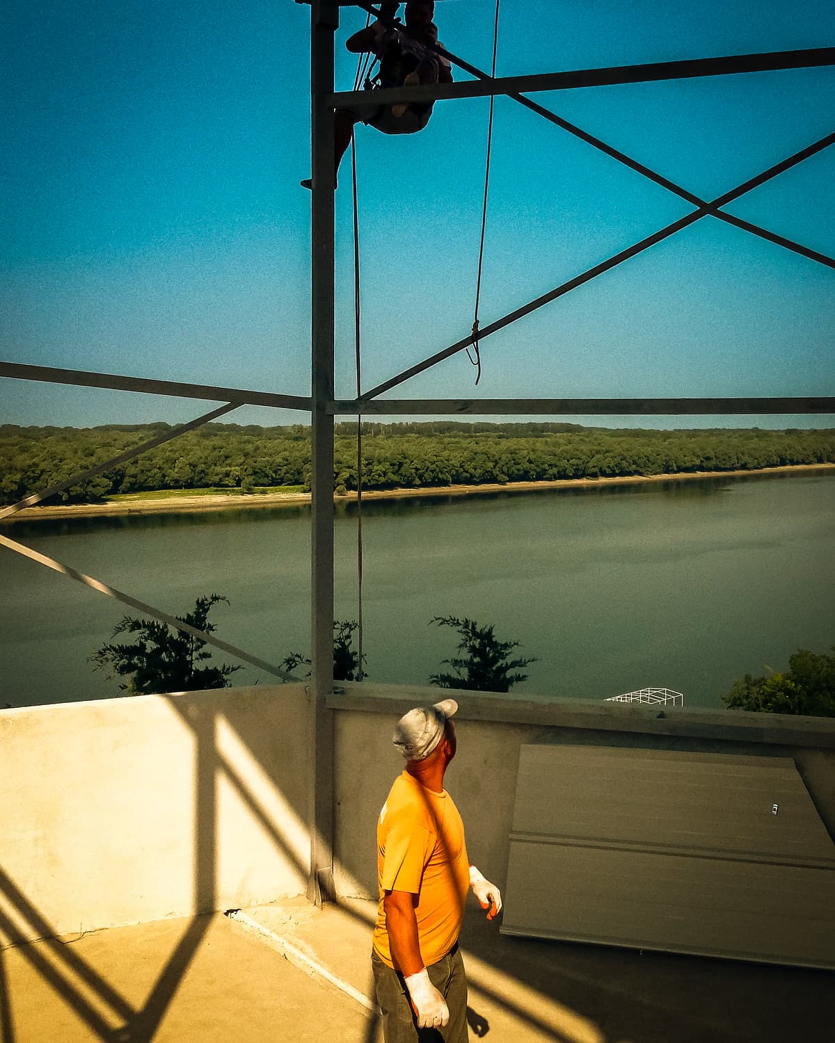 Worker on the winery construction site with the Danube in the background