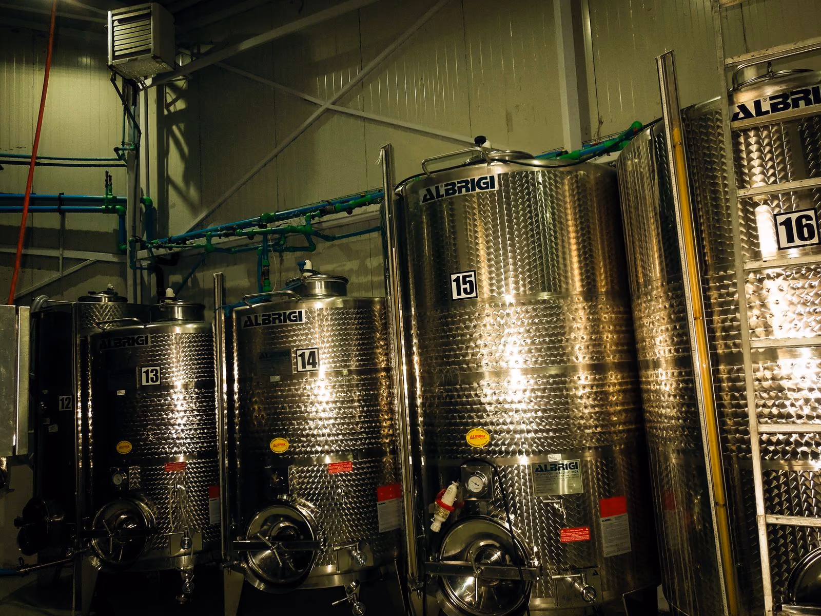 Numbered stainless-steel tanks in the winery